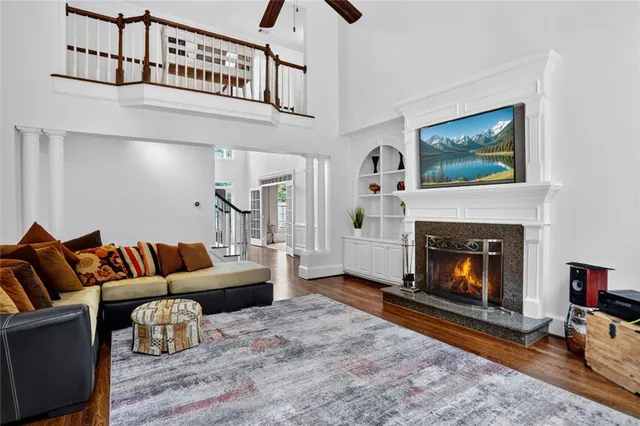 a room with pool table and glass windows