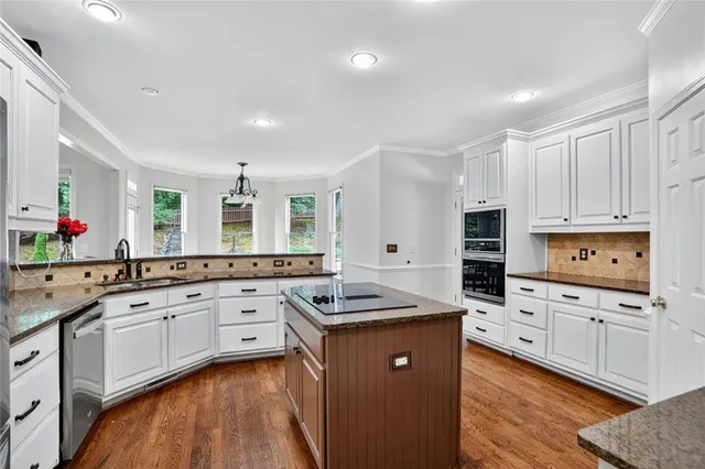 a view of walk in closet with clothes