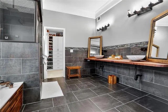 a front view of a house with swimming pool garden and patio