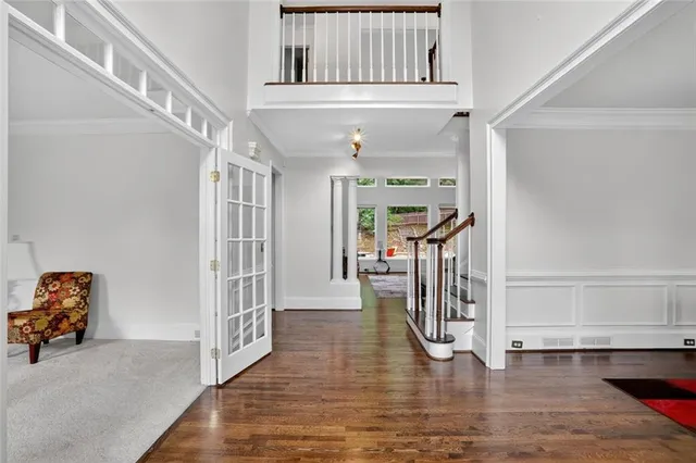 a view of a dining room with furniture window and wooden floor