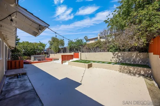 a view of a backyard with swimming pool