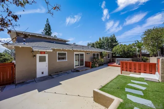 a front view of house with yard patio and green space
