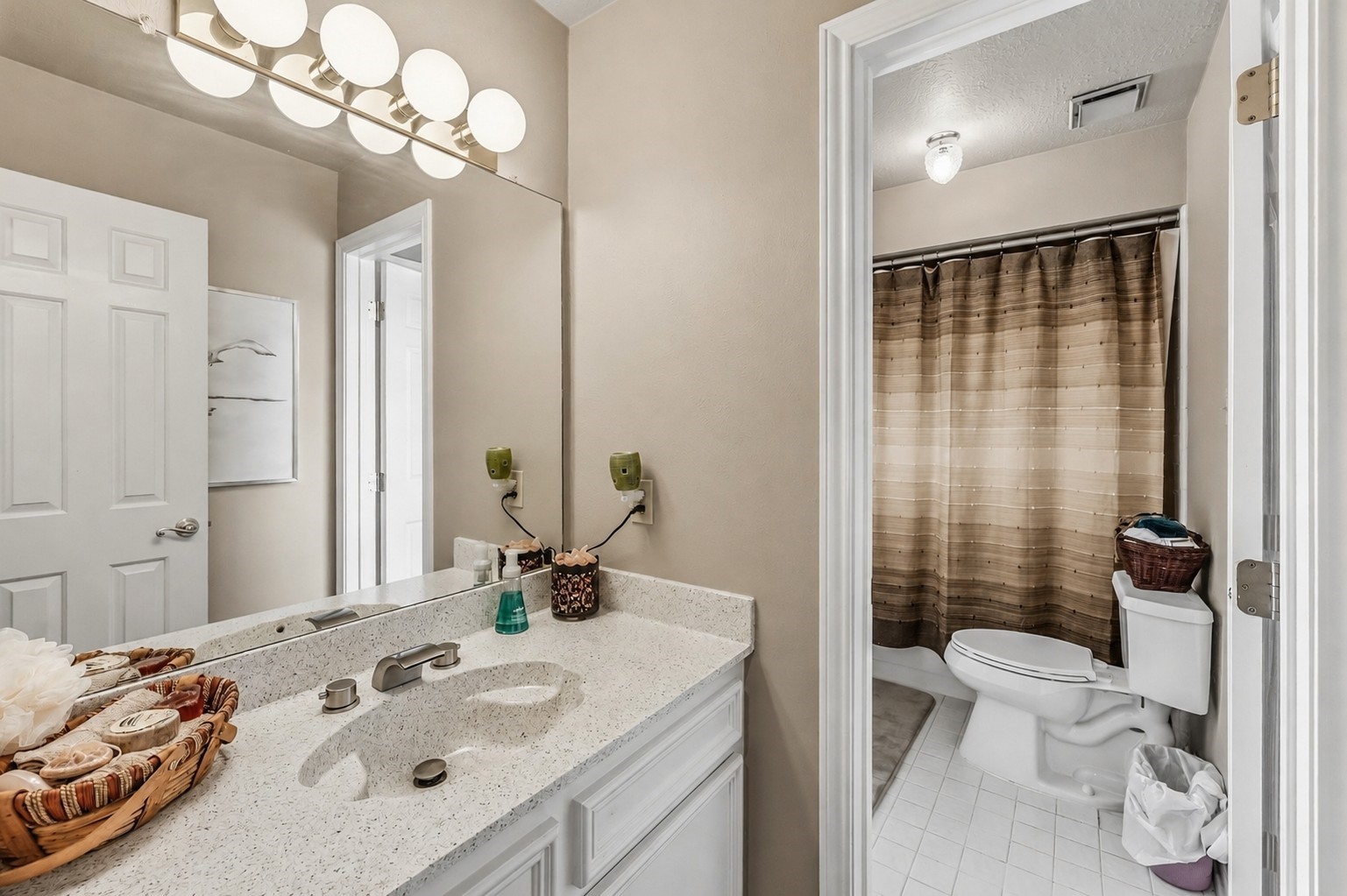 6047 Spring Creek Lane Spring, TX 77379 - Photo 35 of 50 The adjoining vanity area gives the Jack and Jill bath added privacy and everyday convenience, allowing each bedroom to maintain its own personal space. Soft neutral tones and clean, classic finishes keep the design feeling timeless and well coordinated with the rest of the home.