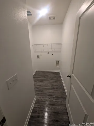 a view of small space with racks on the wall