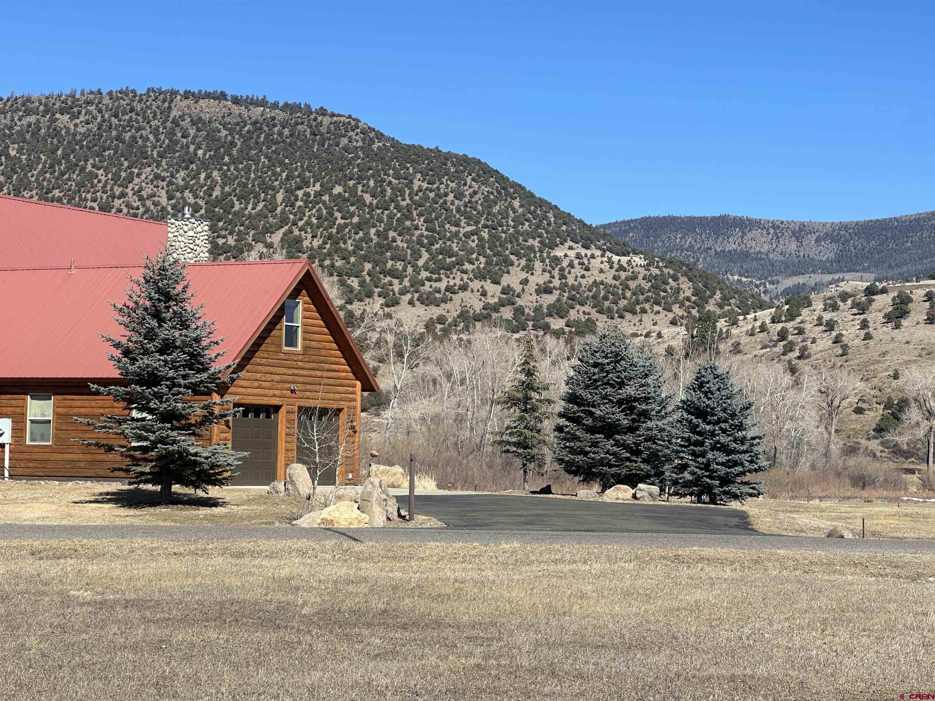160 West Riverside Court South Fork, CO 81154 - Photo 9 of 16 a front view of a house with a yard