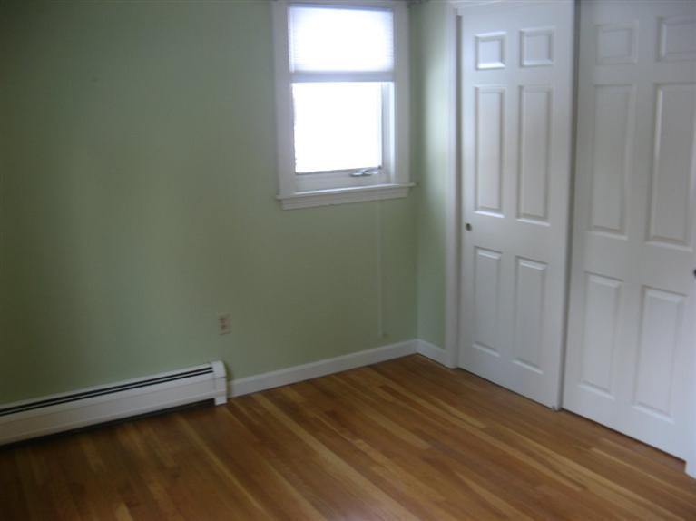 172 Ralyn Road Cotuit, MA 02635 - Photo 11 of 12 an empty room with a window