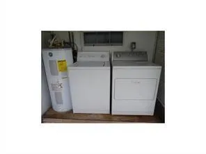 a kitchen with a sink and a microwave