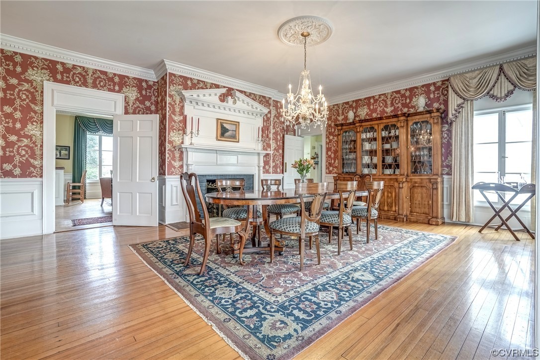 4750 Warner Hall Road Gloucester, VA 23061 - Photo 17 of 49 a view of a dining room with furniture window and wooden floor
