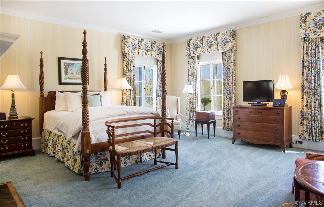 4750 Warner Hall Road Gloucester, VA 23061 - Photo 23 of 49 a bedroom with furniture and a flat screen tv