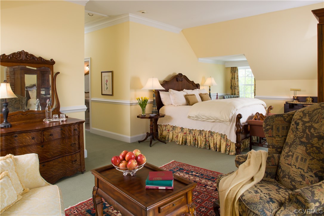 4750 Warner Hall Road Gloucester, VA 23061 - Photo 24 of 49 a bedroom with a bed and wooden floor