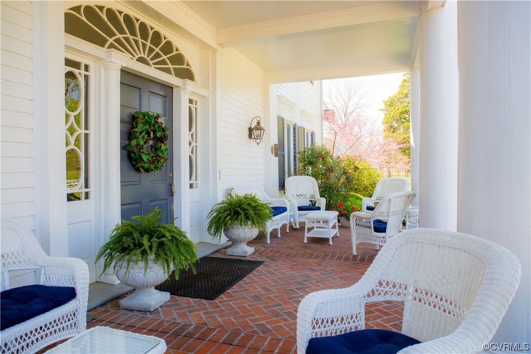 4750 Warner Hall Road Gloucester, VA 23061 - Photo 3 of 49 a living room with furniture and a potted plant