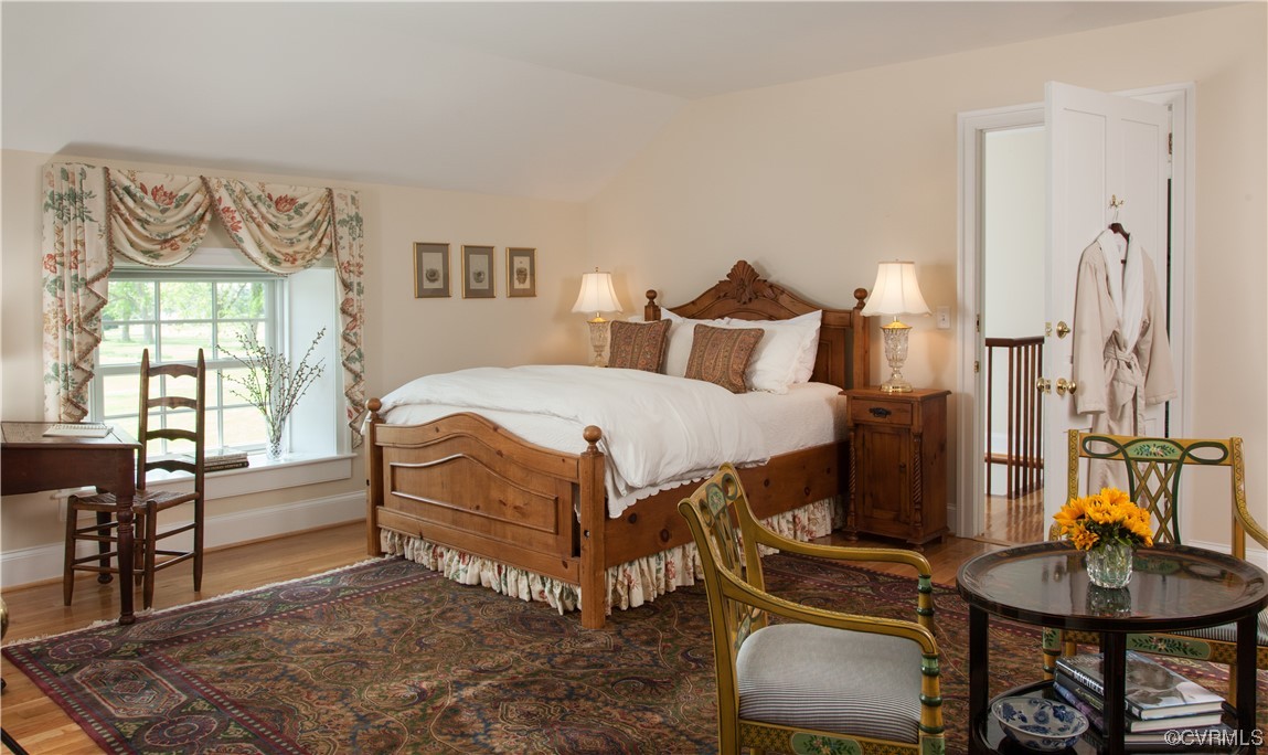 4750 Warner Hall Road Gloucester, VA 23061 - Photo 35 of 49 a bedroom with a bed and a chair