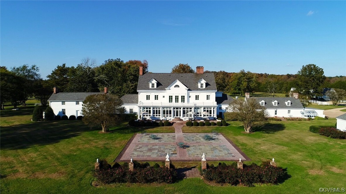 4750 Warner Hall Road Gloucester, VA 23061 - Photo 4 of 49 a view of a house with garden and patio