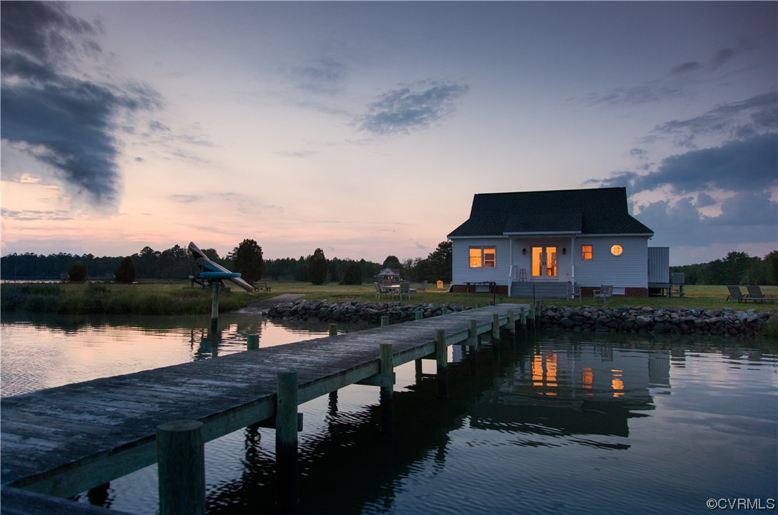 4750 Warner Hall Road Gloucester, VA 23061 - Photo 42 of 49 a lake view with boat and palm trees