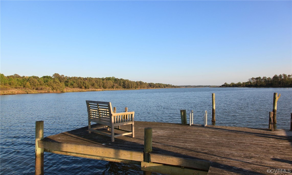 4750 Warner Hall Road Gloucester, VA 23061 - Photo 44 of 49 a view of a terrace with wooden floor and lake view