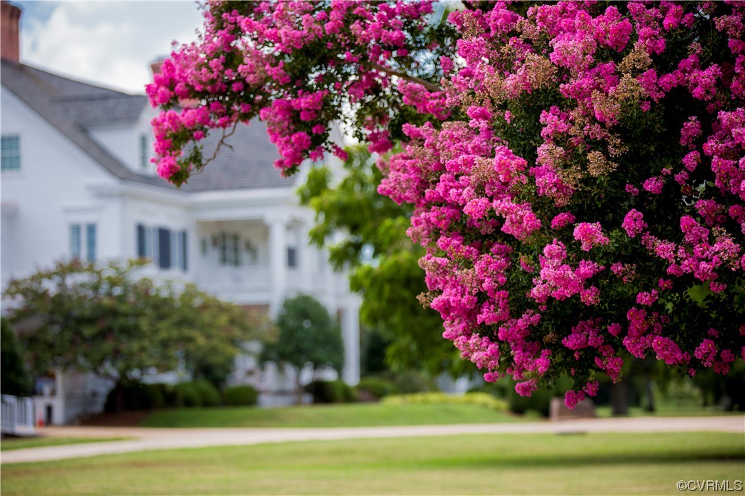 4750 Warner Hall Road Gloucester, VA 23061 - Photo 45 of 49 a front view of a house with a yard and fountain