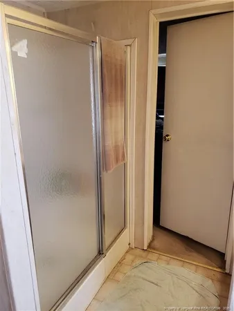 a kitchen with stainless steel appliances kitchen island granite countertop a refrigerator stove and sink