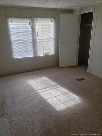 a view of a dining room with furniture and window