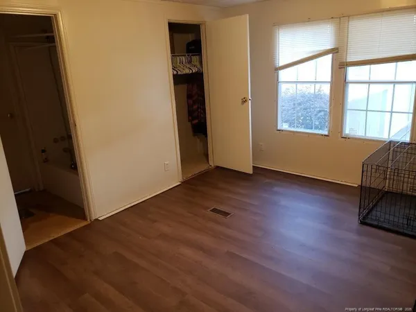 a view of a balcony with wooden floor