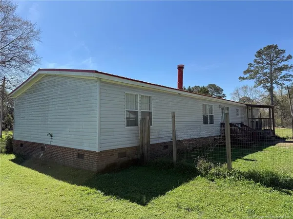 an empty room with a mirror