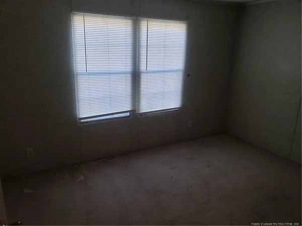 a bathroom with a bathtub and a window