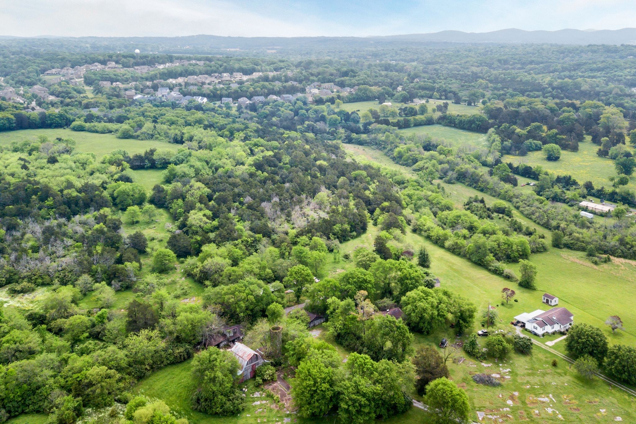 0 Nolensville Road Brentwood, TN 37027 - Photo 5 of 27 an aerial view of a houses with a lush green hillside