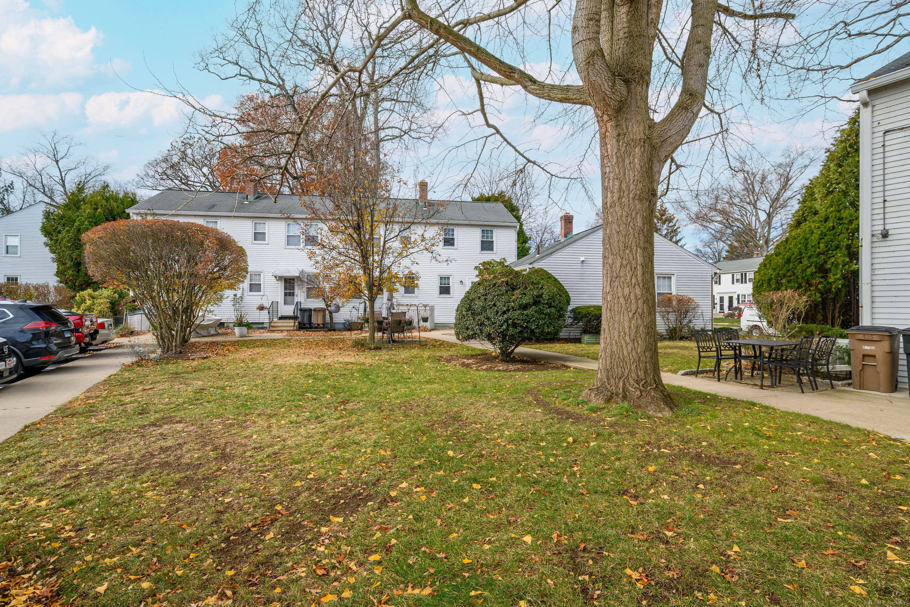 114 Sylvan Knoll Road Stamford, CT 06902 - Photo 19 of 23 a view of backyard with outdoor seating and plants