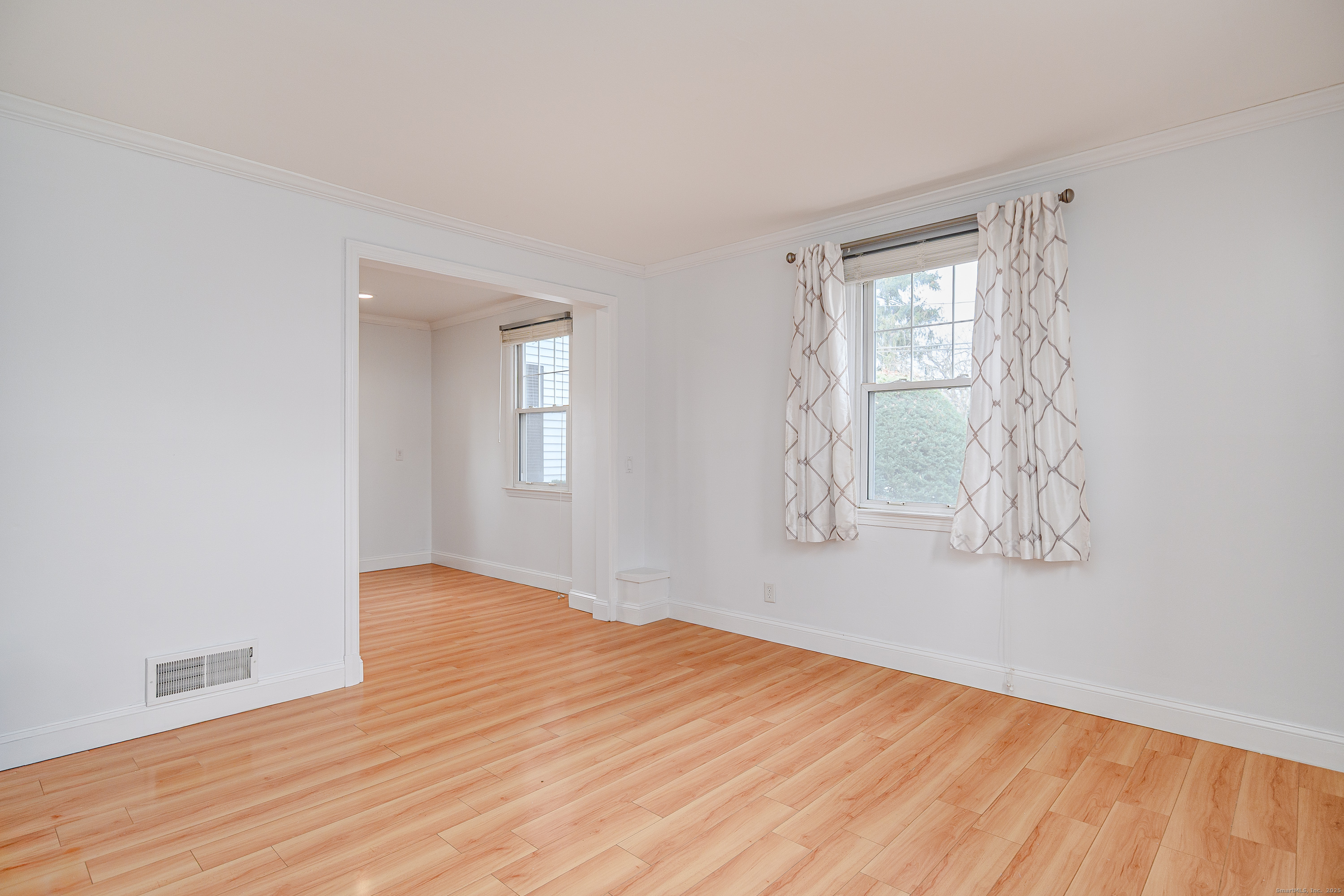 114 Sylvan Knoll Road Stamford, CT 06902 - Photo 3 of 23 a view of empty room with wooden floor and fan