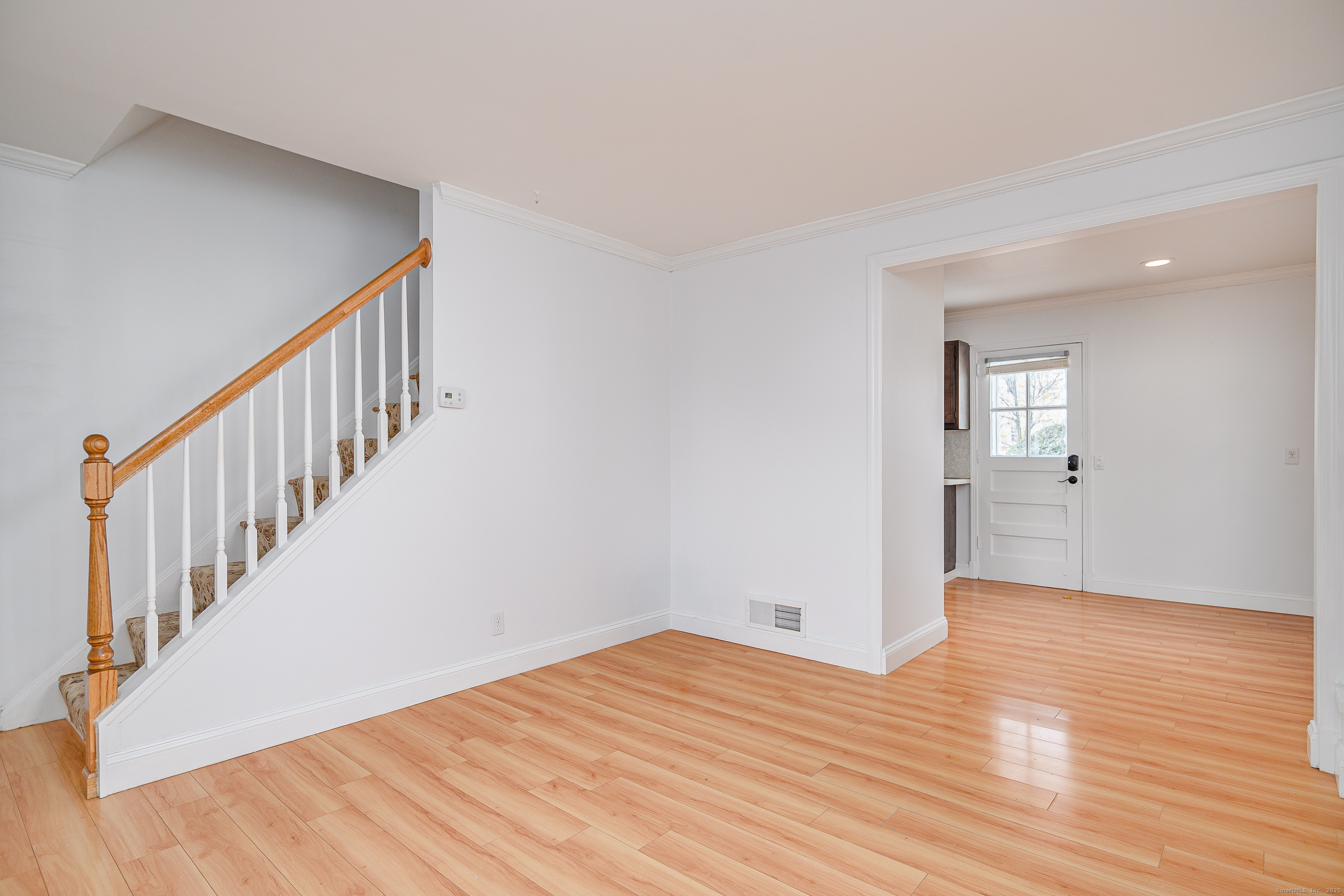 114 Sylvan Knoll Road Stamford, CT 06902 - Photo 4 of 23 a view of an empty room with wooden floor