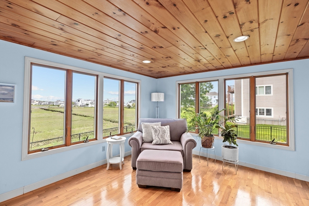 8 Cliff Estates Road, Unit 8 Scituate, MA 02066 - Photo 13 of 36 a living room with furniture and a large window