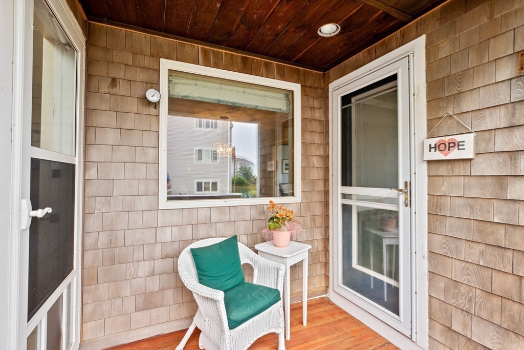8 Cliff Estates Road, Unit 8 Scituate, MA 02066 - Photo 26 of 36 a front view of a house with outdoor seating