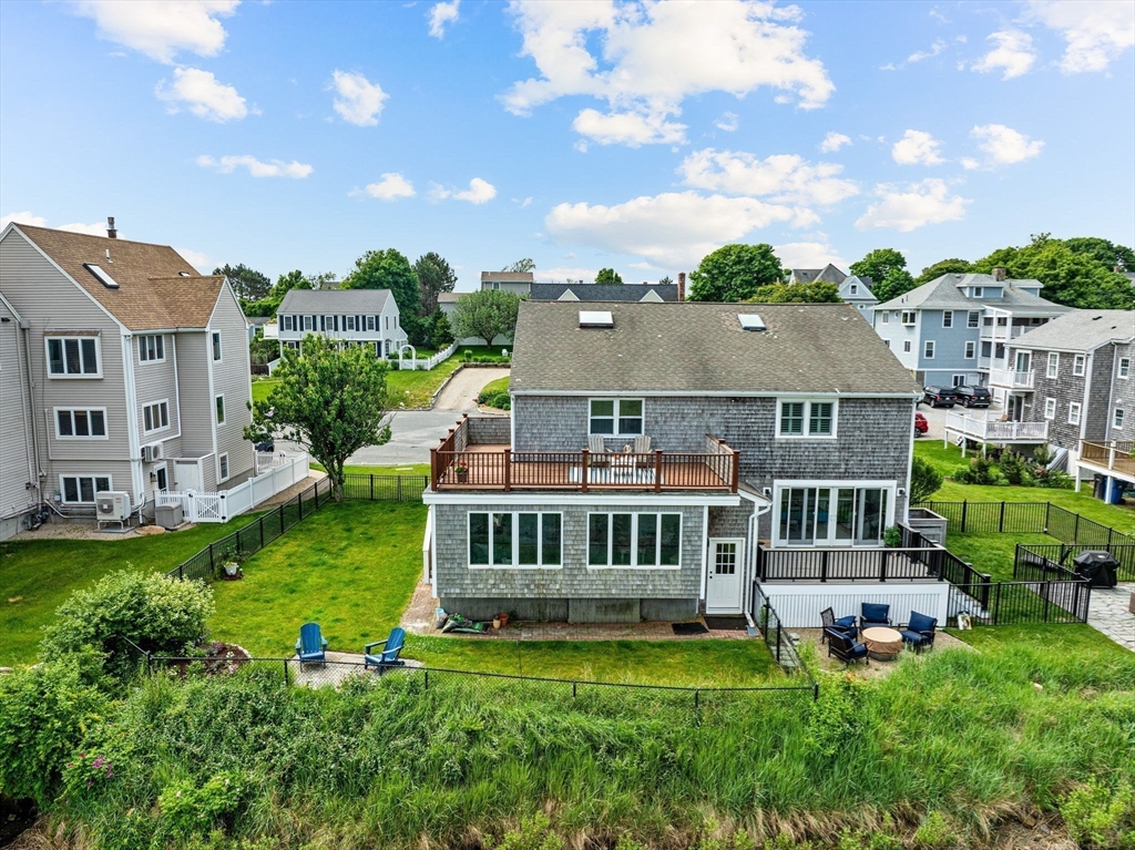 8 Cliff Estates Road, Unit 8 Scituate, MA 02066 - Photo 4 of 36 an aerial view of a house with a garden and plants