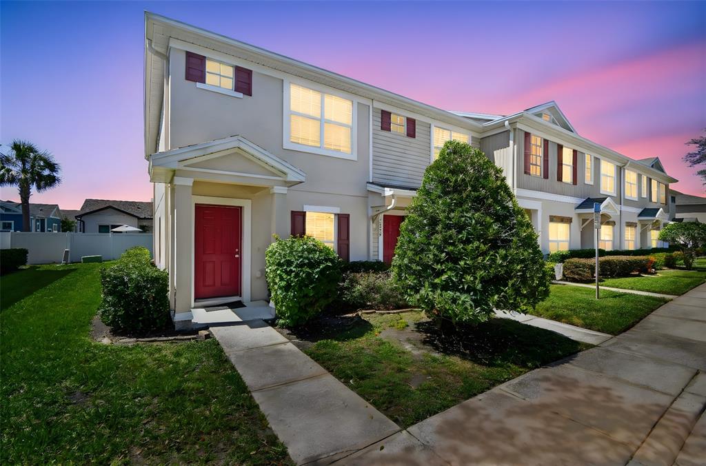 a front view of a house with garden