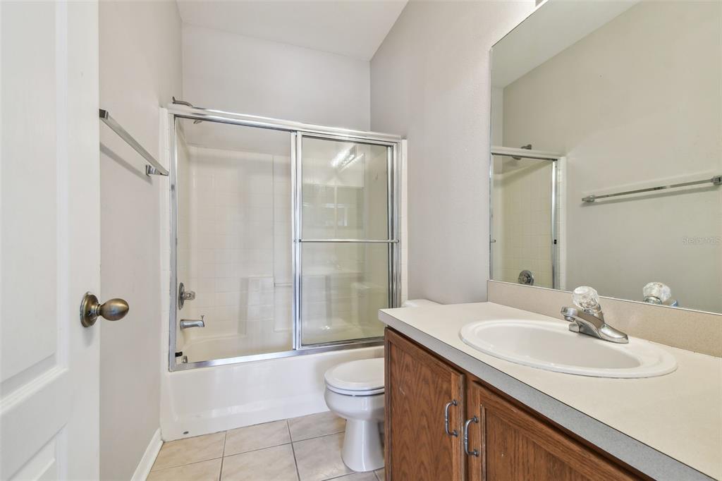16227 Swan View Circle Odessa, FL 33556 - Photo 16 of 29 a bathroom with a sink a toilet and shower