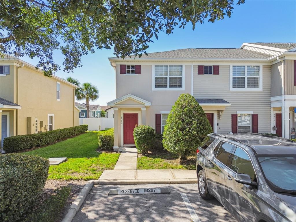 16227 Swan View Circle Odessa, FL 33556 - Photo 24 of 29 a front view of a house with a yard