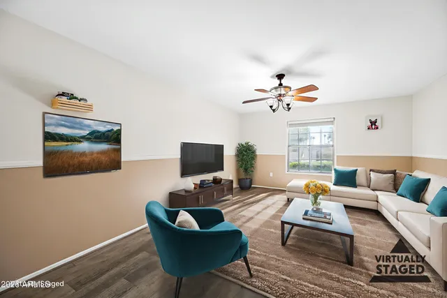 a living room with furniture and a flat screen tv