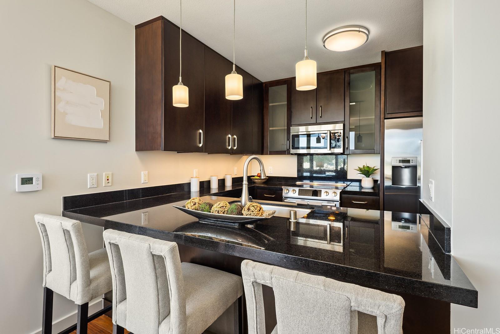1189 Waimanu Street, Unit 4204 Honolulu, HI 96814 - Photo 5 of 25 Modern kitchen with stainless steel appliances