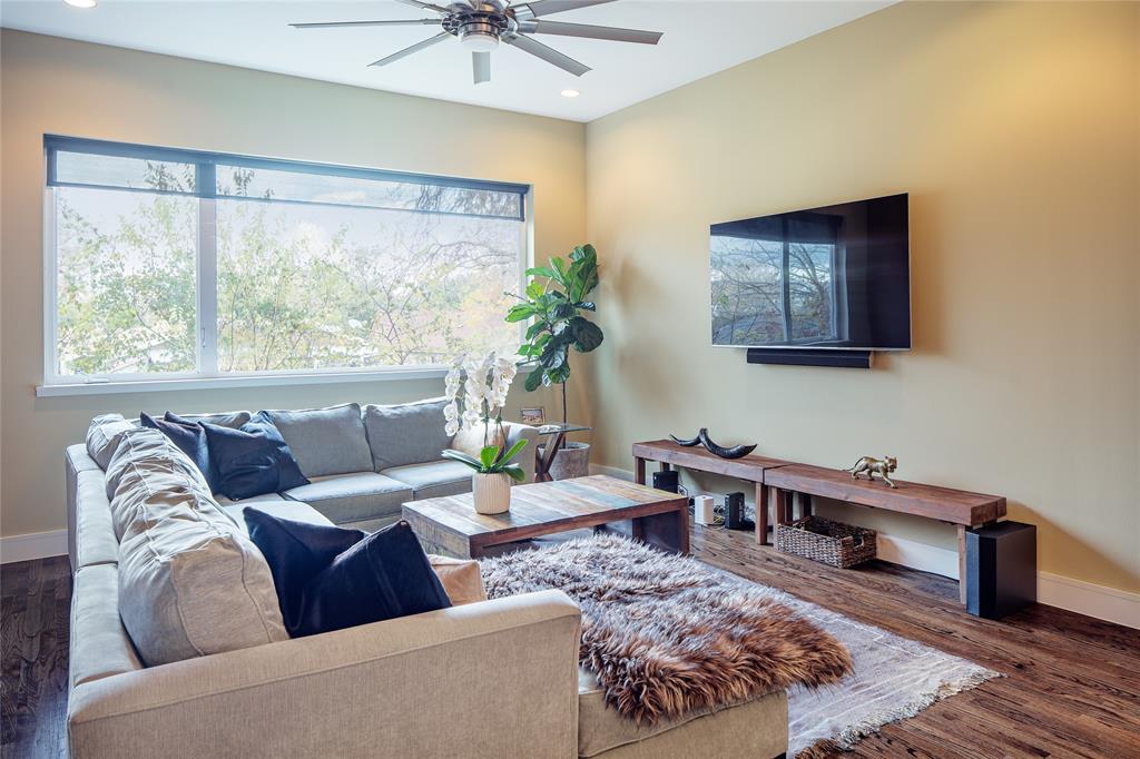 4610 Steel Street Dallas, TX 75219 - Photo 5 of 10 a living room with furniture and a large window