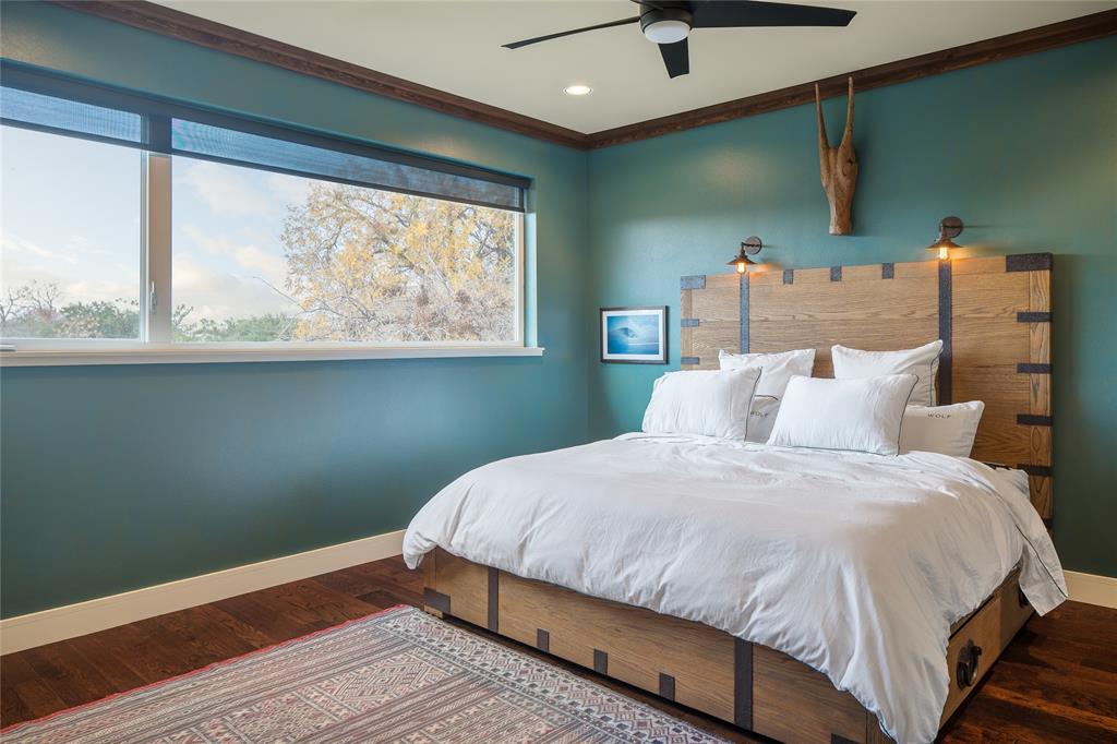 4610 Steel Street Dallas, TX 75219 - Photo 8 of 10 a bedroom with a bed and window