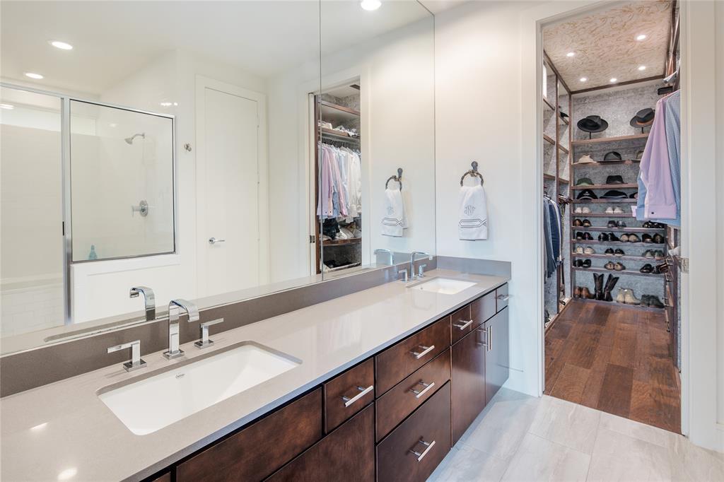 4610 Steel Street Dallas, TX 75219 - Photo 9 of 10 a spacious bathroom with a double vanity sink mirror and shower