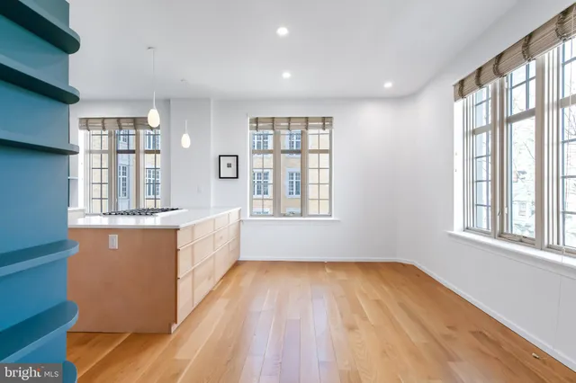 a kitchen that has a stove and a table