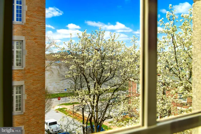 a room with a dresser and a window