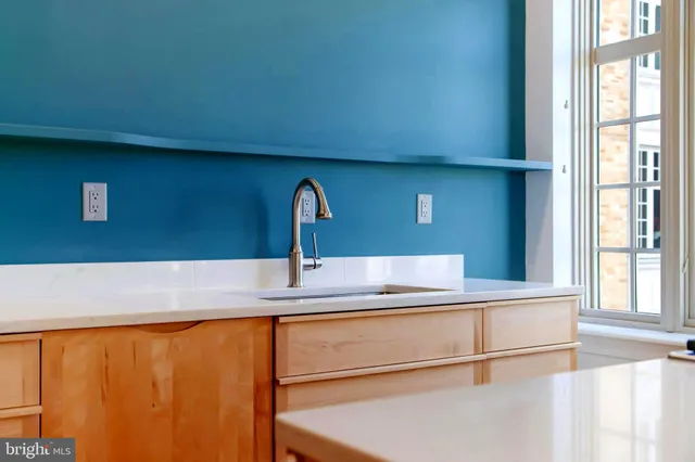 a kitchen with a stove and a sink