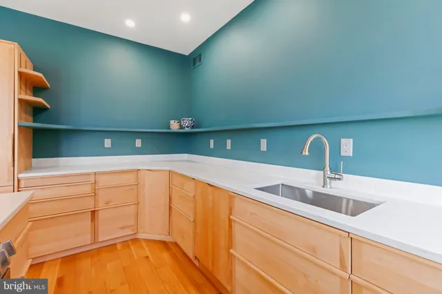 a kitchen with a stove and a microwave