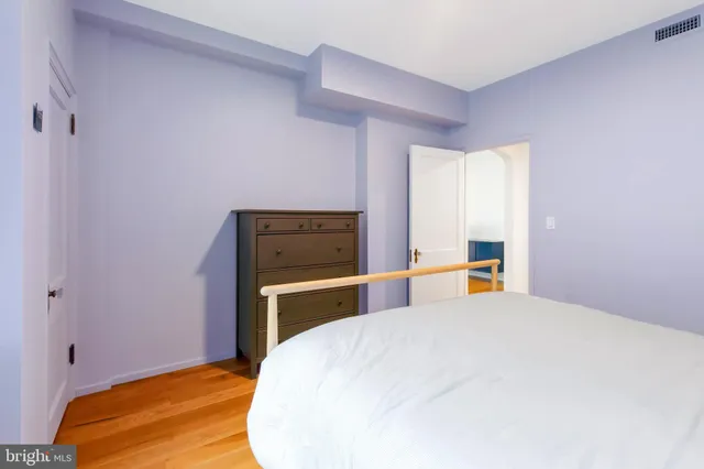 a view of a bedroom with wooden floor and bedroom