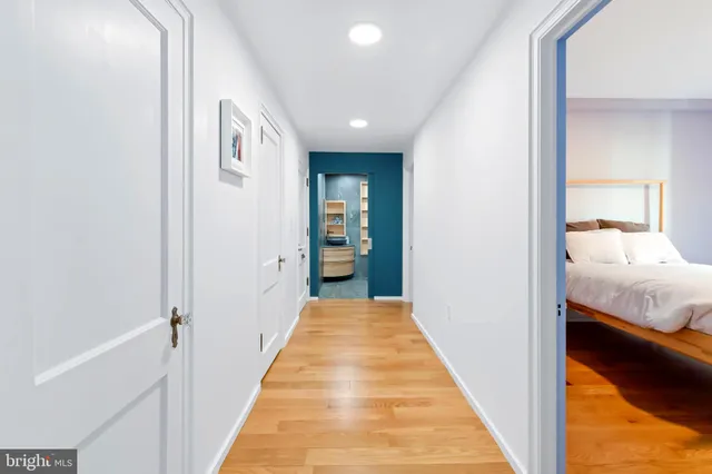 a workspace room with furniture and wooden floor
