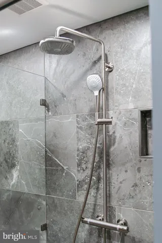 a view of a lake with couches chairs