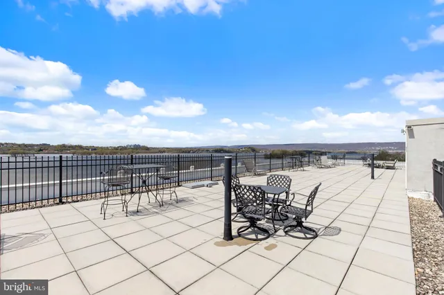 a view of roof deck with seating space