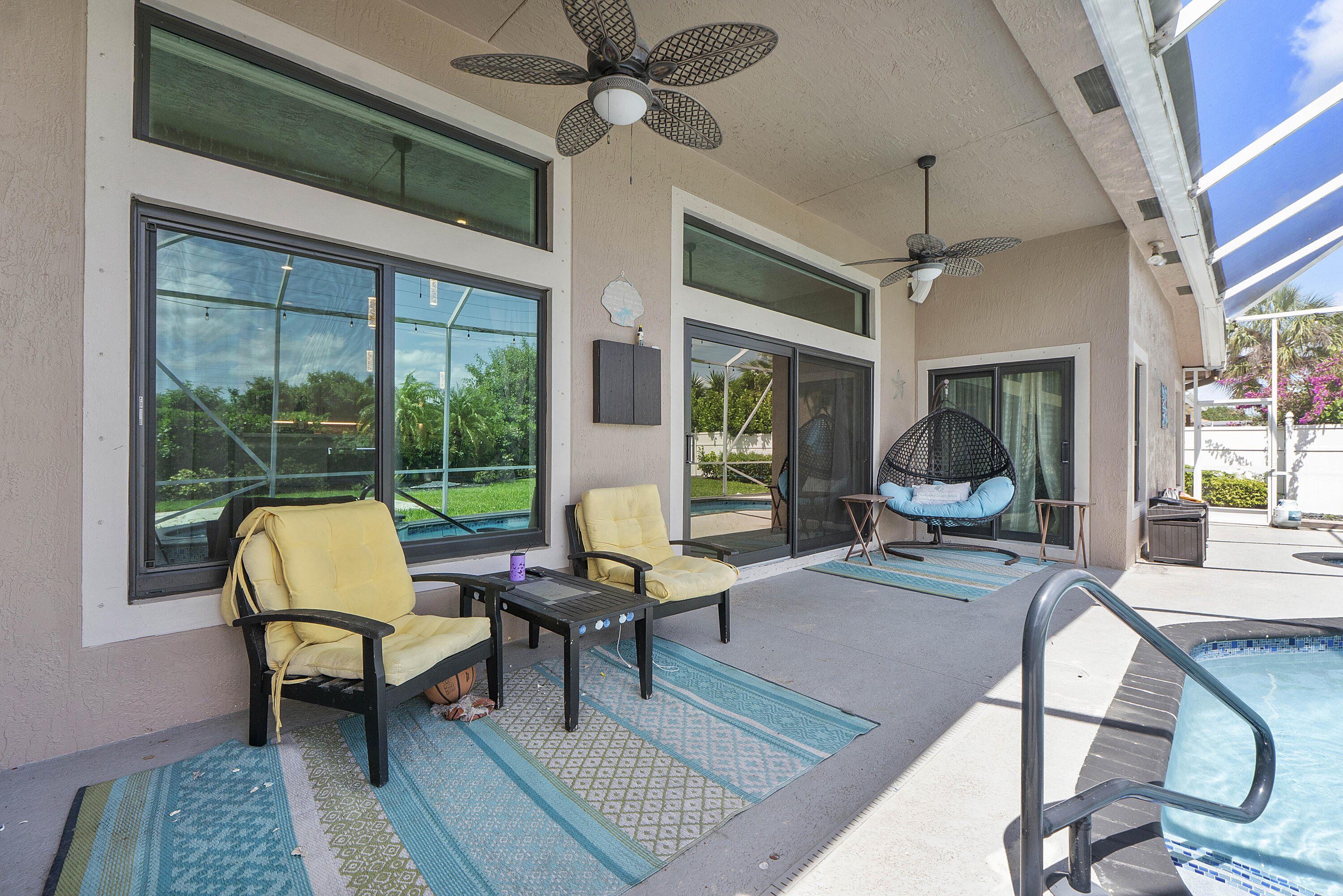 12328 St Simon Drive Boca Raton, FL 33428 - Photo 32 of 52 a living room with furniture and a large window