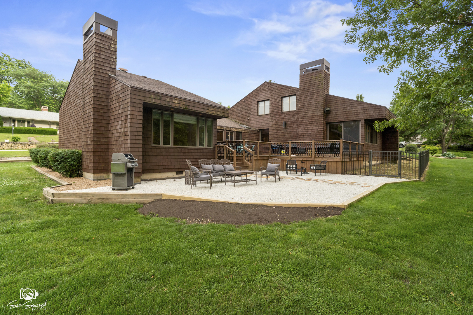 a front view of house with yard and outdoor seating
